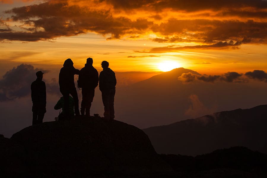 Kilimanjaro/tanzania,-,January,26,,2018:,A,Group,Of,Hikers,Watching Kilimanjaro/Tanzania - January 26, 2018: A group of hikers watching sunset on mount Kilimanjaro in on of the camps.